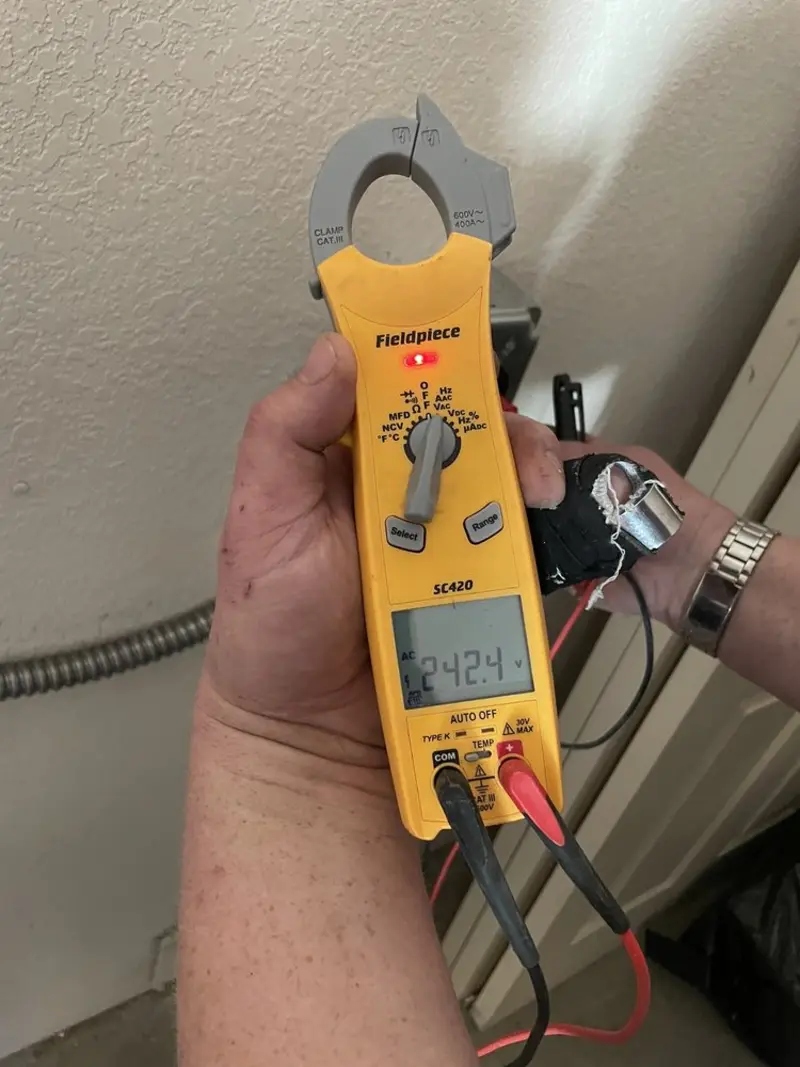 Voltage testing with clamp meter during Outlet Installation in Crestline